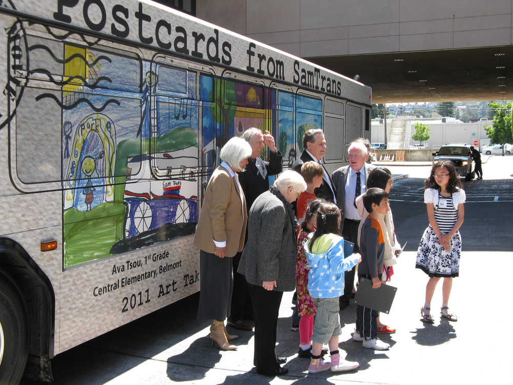 SamTrans Board members and the Art Takes a Bus Ride contest winners take a look at their art work displayed on the Art Bus. The bus will be used to provide regular service throughout the SamTrans service area for the next year.