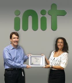 INIT CEO, Roland Staib accepted the Zero Waste to Landfill Certification presented by Deborah Albero-Darata of TFC Recycling.