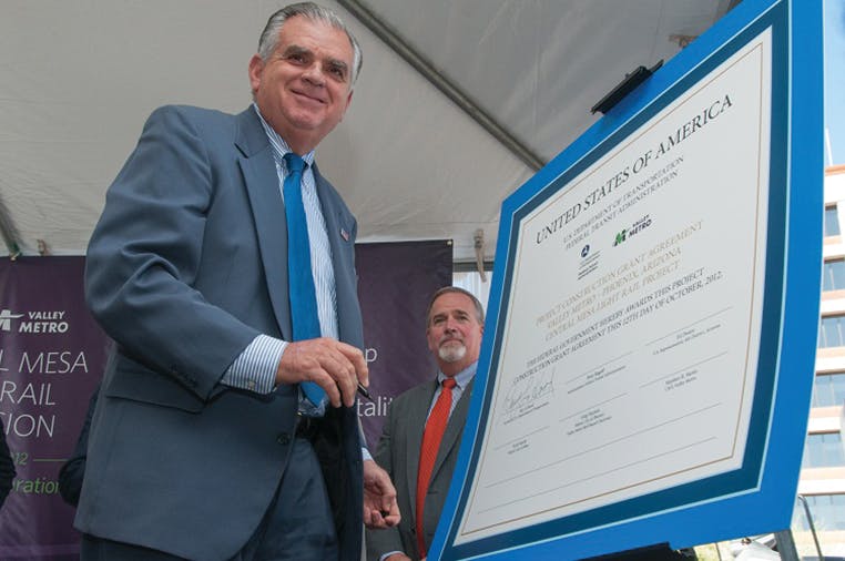U.S. Transportation Secretary Ray LaHood signs the funding agreement with Valley Metro CEO, Steve Banta