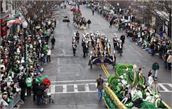 Thousands of spectators crowd the streets of the Boston St. Patrick&apos;s Day Parade in South Boston,