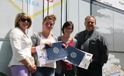 From left to right, RTC General Manager Tina Quigley joins Las Vegas Academy students Desiree Hogue and prize winner Jessica Judd, with Las Vegas Academy Principal Scott Walker during the Earth Day Contest event to unveil Judd&rsquo;s winning artwork.