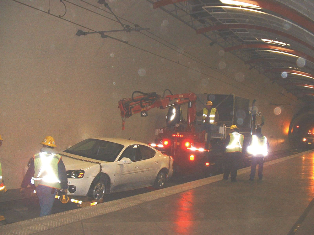 A car deep in a tunnel on the tracks at TriMet required a disruption in service while a crane car had to come and lift the car out of the ROW.