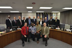 Back row are all Metra Board Members, from left to right, Stanley C. Rakestraw, William A. Widmer III, Don A. De Graff, Paul C. Darley, Jack Schaffer, Chairman Brad S. O&rsquo;Halloran, Mike McCoy, Arlene J. Mulder, Norman Carlson, Larry A, Huggins and Jack E. Partelow. Front row, from left to right, Steve East, carman and safety captain at 47th Street Diesel Shop; Shon George, superintendent, 47th Street; Lawrence Evans, machinist and safety captain at 47th Street; and Kevin McCann, director, Rock Island District Mechanical Department.