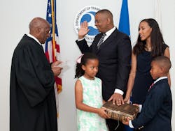 Anthony Foxx is flanked by his family while being sworn in by Judge Nathaniel Jones during a private ceremony July 2. Anthony Foxx is flanked by his family while being sworn in by Judge Nathaniel Jones during a private ceremony July 2.