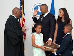 Anthony Foxx is flanked by his family while being sworn in by Judge Nathaniel Jones during a private ceremony July 2.