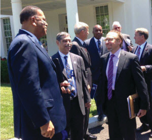 Front row, left-to-right: Christopher Walton, director of Broward County Transportation Department; Chuck Cohen, director, Palm Tran (Palm Beach); Peter Rogoff, administrator, Federal Transit Administration; Back row: San Diego and Jacksonville transit officials.