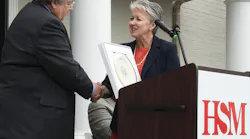 Dave Colburn, HSM president and CEO, accepts a gift from Sharon Decker, North Carolina Commerce Secretary, on behalf of North Carolina Governor Pat McCrory in recognition of HSM qualifying for a performance-based grant from the One North Carolina fund of up to $200,000. HSM plans to create 162 new jobs and invest more than $3.3 million over the next three years in Hickory and Conover, N.C