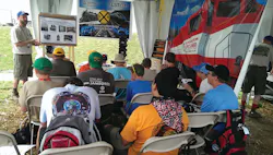 Eric Cutright, Ph.D., explains the advanced computer technology being used in the rail industry to the technology-driven generation of Scouts.