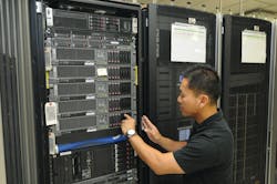 Senior Communications Systems Analyst Minh Nguyen works on a VTA server. Senior Communications Systems Analyst Minh Nguyen works on a VTA server.