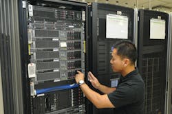 Senior Communications Systems Analyst Minh Nguyen works on a VTA server.