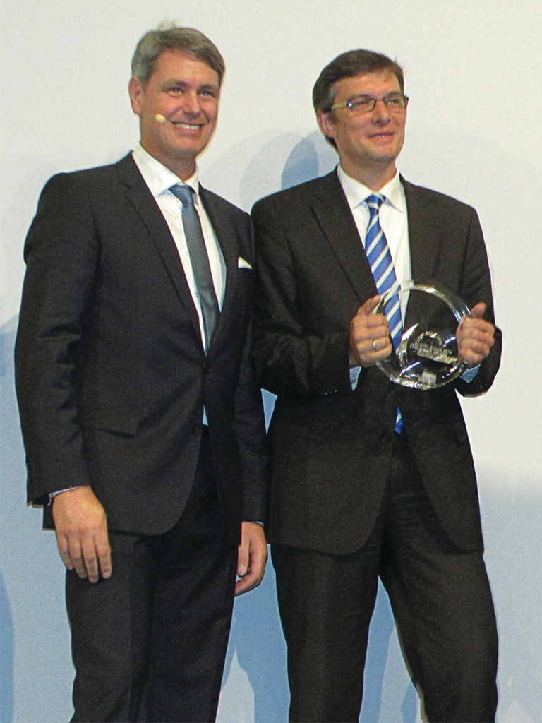 Daniel D&ouml;rflinger accepts the eCarTec Award on behalf of Conductix-Wampfler.