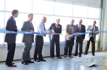 Officials take part in a ceremony opening up the new operations center for the Macatawa Area Express.