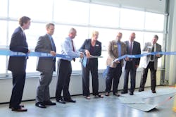 Officials take part in a ceremony opening up the new operations center for the Macatawa Area Express. Officials take part in a ceremony opening up the new operations center for the Macatawa Area Express.