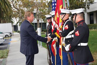 Orange County Transportation Authority CEO Darrell Johnson greets a Marine Corps Color Guard at OCTA&rsquo;s annual Veterans Day Appreciation Event on Nov. 12 at OCTA headquarters in Orange.