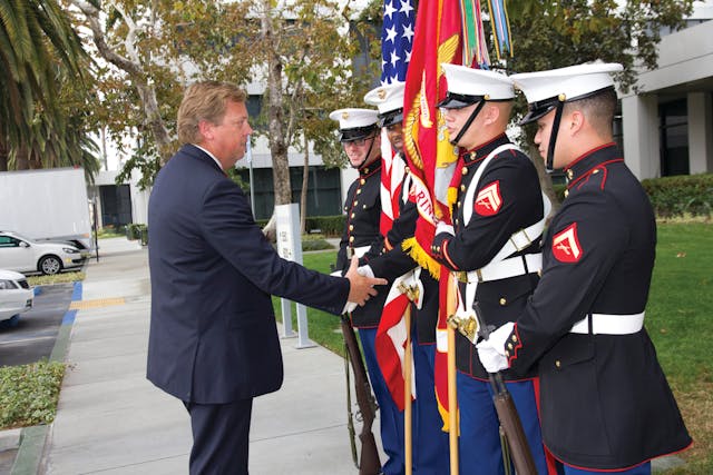 Orange County Transportation Authority CEO Darrell Johnson greets a Marine Corps Color Guard at OCTA&rsquo;s annual Veterans Day Appreciation Event on Nov. 12 at OCTA headquarters in Orange.