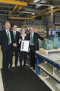 The 100,000th New Ecoline reciprocating compressor being presented to the Polish trading partner Berling S.A.. From left to right, Frank Fuhlbr&uuml;ck, Bitzer Schkeuditz plant manager; Volker Stamer, director of stationary products at Bitzer; Hanna Berling, CEO of Berling S.A.; and Michael Eichberger managing director Bitzer Austria.