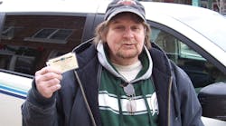 Dennis Carter was recently recognized for being the 200,000 passenger to ride Harbor Transit during 2013. He is shown here with the one month bus pass he was awarded for this distinction.