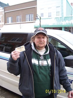 Dennis Carter was recently recognized for being the 200,000 passenger to ride Harbor Transit during 2013. He is shown here with the one month bus pass he was awarded for this distinction.