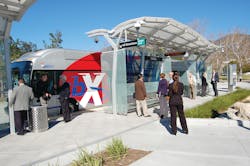 Omnitrans&apos; sbX vehicle at California State University, San Bernardino station.