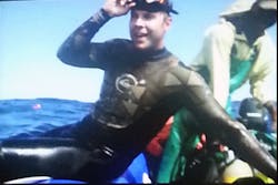 A slide from Andrew Evans' presentation showing his relief at being alive after swimming in open waters, swarmed by Great White Sharks. A slide from Andrew Evans' presentation showing his relief at being alive after swimming in open waters, swarmed by Great White Sharks.