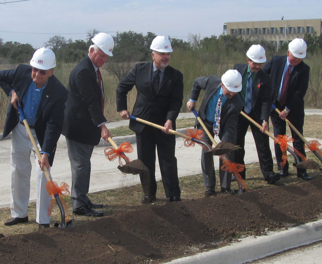 VIA Metropolitan Transit Board Chairman Henry R. Mu&ntilde;oz III (third from left) is flanked by other local officials as they turn dirt on a new park-and-ride facility on the far north side of San Antonio.