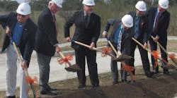 VIA Metropolitan Transit Board Chairman Henry R. Mu&ntilde;oz III (third from left) is flanked by other local officials as they turn dirt on a new park-and-ride facility on the far north side of San Antonio.