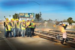 Mesa Mayor Scott Smith and East Valley Institute of Technology welding student, Sierra Jennings, ignite the first official rail weld for the Central Mesa light rail extension.