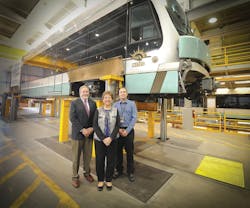 Steve Banta, Valley Metro CEO (left), Glendale Mayor Elaine Scruggs (center) and Sam Stevenson (right) meet and tour the Valley Metro Operations and Maintenance Center.