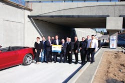 Officials from the Orange County Transportation Authority and the cities of Placentia and Fullerton commemorate the O.C. Bridges project on Placentia Avenue that opened to traffic March 12.
