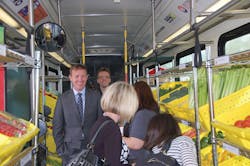 Valley Metro Chair and Mesa Councilmember, Scott Somers (left), with &ldquo;passengers&rdquo; aboard the Fresh Express bus.
