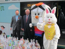 Via President/CEO Jeff Arndt is joined by Via Board member Steve Allison, Buster the Bus, and the Easter Bunny as they prepare to distribute Easter baskets donated by Via employees.