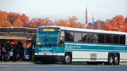 One of PRTC&rsquo;s MCI buses picks up passengers bound for the Pentagon.