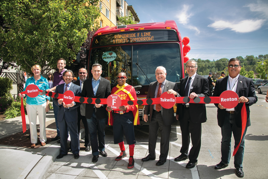 From left to right, Renton City Councilmember Marcie Palmer, King County Councilmember Dave Upthegrove, King County Department of Transportation Director Harold Taniguchi, Metro Transit Service Development Manager Victor Obeso, King County Executive Dow Constantine, RapidRide Man, Tukwila Mayor Jim Haggerton, Federal Transit Administration Deputy Regional Administrator Ken Feldman and Renton Mayor Denis Law.