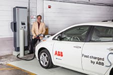 Ken Graber, director of media relations at ABB, charges the company&rsquo;s Nissan Leaf at the UWM quick-charge station in the Klotsche Center &amp; Pavilion parking structure
