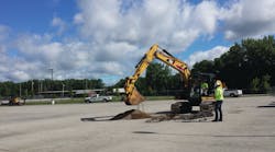 Workers perform a soil check at the site of a CNG fueling station.