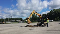 Workers perform a soil check at the site of a CNG fueling station. Workers perform a soil check at the site of a CNG fueling station.