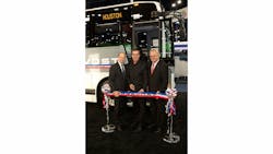 Prevost cuts the ribbon on its new commuter coach during the APTA Expo.
