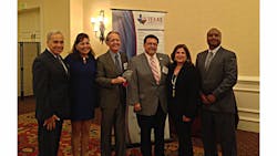 Via officials, led by VIA Board member Dr. Richard Gambitta and Via Board Chairman Alexander Brise&ntilde;o (3rd and 4th from left) accept the award from the Texas Diversity Council.
