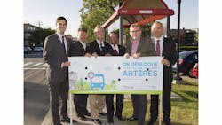 Leaders celebrate the completion of a lane for buses and taxis in Montreal. Leaders celebrate the completion of a lane for buses and taxis in Montreal.