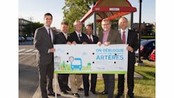 Leaders celebrate the completion of a lane for buses and taxis in Montreal. Leaders celebrate the completion of a lane for buses and taxis in Montreal.
