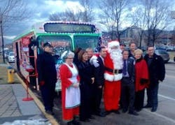 Kelowna Mayor Colin Basran with Santa and Mrs. Claus in front of Kelowna City Hall.