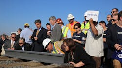 Attendees of the ground breaking on the nation&rsquo;s first HSR system in California sign the rails.