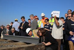 Attendees of the ground breaking on the nation&rsquo;s first HSR system in California sign the rails.