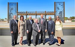 Local and federal elected officials pose in front of the Mesa Dr./Main St. station, with Mesa Vice Mayor and Valley Metro Rail Board Chair Dennis Kavanaugh holding the Central Mesa Light Rail commemorative pin, fourth in the series.