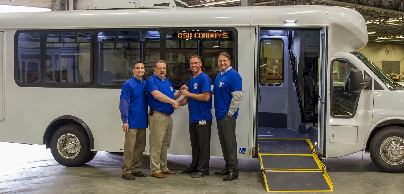 Joe Kizinski, regional sales Arboc, Don Roberts, president and CEO Arboc, Tom Duncan, transit manager Oklahoma State University and Brent Roy, regional sales National Bus Sales.