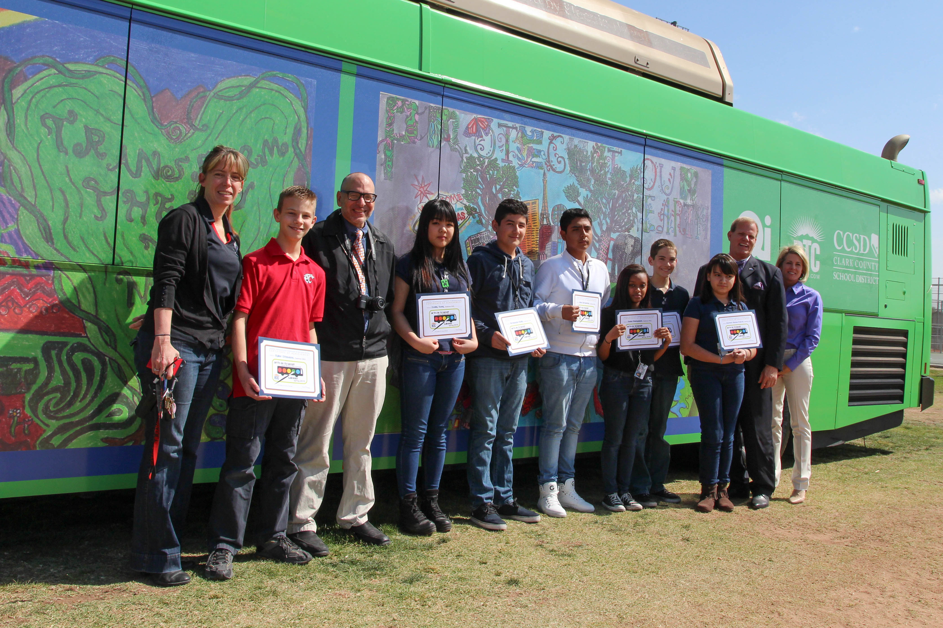 From left to right, Cashman Middle School Principal Misti Taton, Tyler Stevens, Cashman Middle School Art teacher David Vivo, Emily Tung, Armando Avila, Jose Cervantes, Delal Mohamed, Anthony Earl, Heather Macias-Padron, CCSD Trustee Board member Kevin Child, RTC general manager Tina Quigley celebrate the seventh annual RTC Earth Day Art contest.