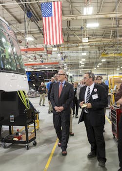 Rep. Kevin Cramer, R-N.D., left, learns about the MCI Commuter Coach assembly line from Ron Storey, Motor Coach Industries Pembina, N.D. plant manager. Rep. Kevin Cramer, R-N.D., left, learns about the MCI Commuter Coach assembly line from Ron Storey, Motor Coach Industries Pembina, N.D. plant manager.