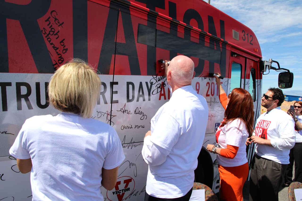 From left to right, RTC General Manager Tina Quigley, Clark County Commissioner and RTC Chairman Larry Brown, City of Henderson Councilwoman and RTC Vice Chair Debra March, and Legislative Director for the Office of Congresswoman Dina Titus Mike Naft, sign their names in support of National Stand Up for Transportation Day
