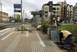Crews work at the Civic Dr MAX Station, laying the conduit for e-fare card readers that will be installed in the future. Crews work at the Civic Dr MAX Station, laying the conduit for e-fare card readers that will be installed in the future.
