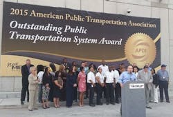 Metro Chairman, Gilbert Garcia, Metro President and CEO, Tom Lambert and Metro staff gather at Downtown Transit Center for big unveiling of APTA Award. Metro Chairman, Gilbert Garcia, Metro President and CEO, Tom Lambert and Metro staff gather at Downtown Transit Center for big unveiling of APTA Award.